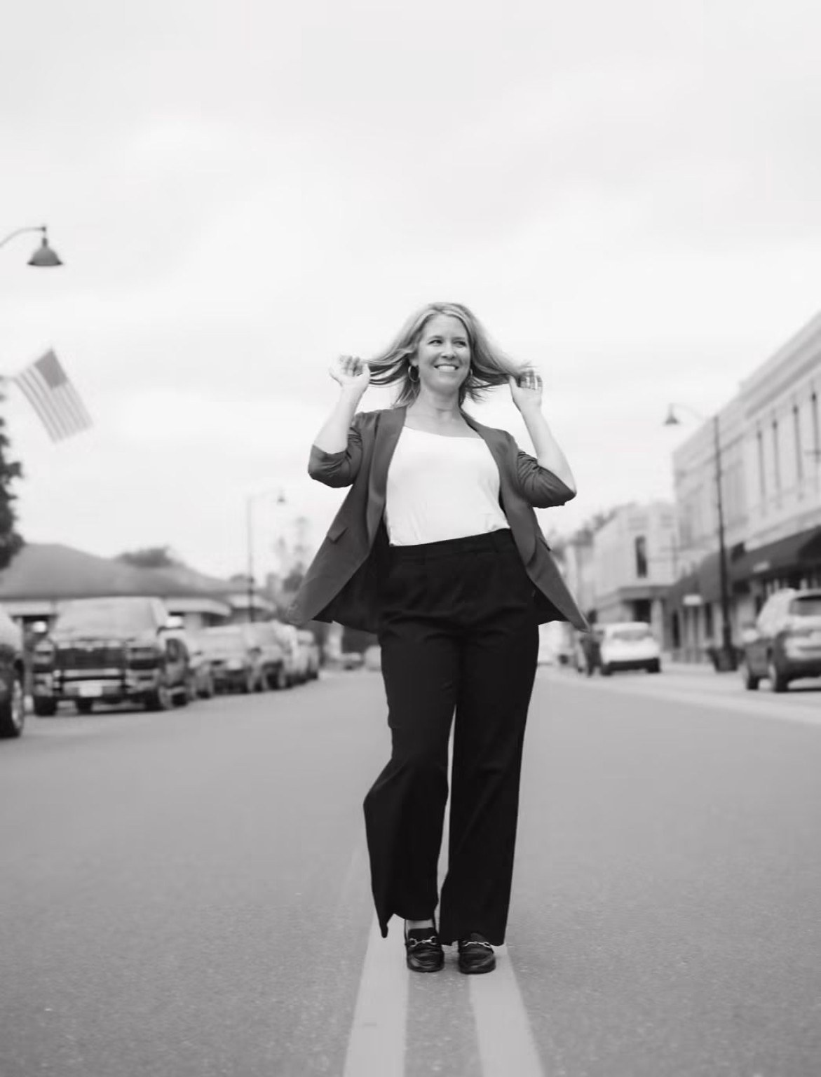 Katie Carstens in a black-and-white street portrait.